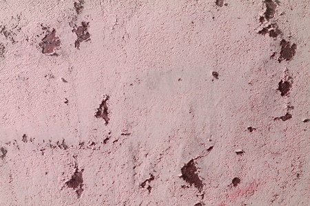 beautiful red shabby holes on plaster on table texture - abstract photo backgroundの写真素材
