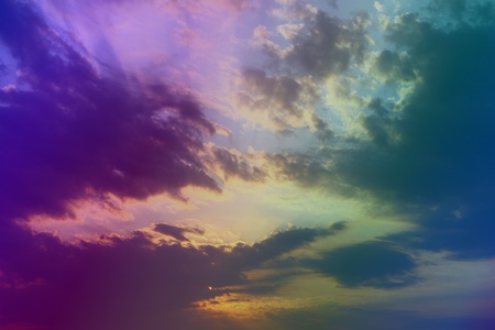 pretty bright sunset or sunrise cloudy sky for using as background in design.