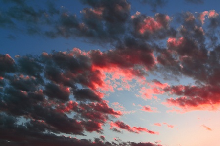 lovely colorful sun colored cloudy sky for using as background in design.