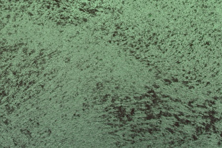 creative old green rough painted metallic surface texture for use as background.