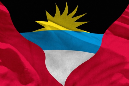 Fluttering Antigua and Barbuda flag for using as texture or background, the flag is waving on the windの写真素材