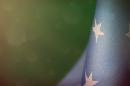 Micronesia hanging flag for honour of veterans day or memorial day on teal, sea-green dark velvet background. Micronesia glory to the heroes of war concept.の写真素材