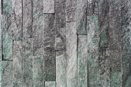 pretty old natural quartzite stone bricks texture for use as background.の写真素材