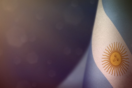 Argentina hanging flag for honour of veterans day or memorial day on blue dark velvet background. Argentina glory to the heroes of war concept.の写真素材