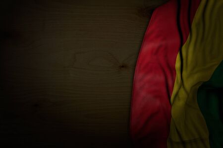 cute dark picture of Bolivia flag with large folds on dark wood with empty place for content - any occasion flag 3d illustrationの写真素材