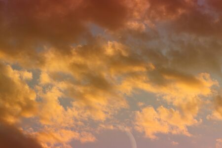 nice vivid sun colored partially cloudy sky for using as background in design.