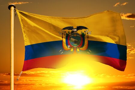 Ecuador flag weaving on the beautiful orange sunset backgroundの写真素材
