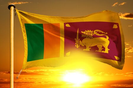 Sri Lanka flag weaving on the beautiful orange sunset backgroundの写真素材