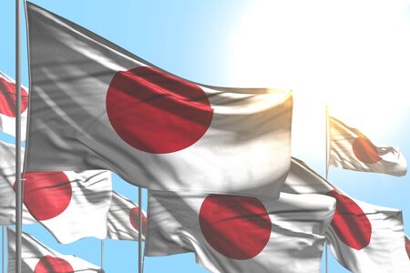 pretty many Japan flags are waving on blue sky background - any occasion flag 3d illustration