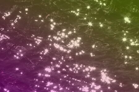 beautiful pink painted sparks on dark water surface texture - abstract photo background