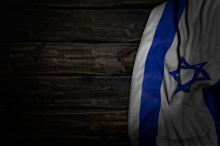 nice dark photo of Israel flag with large folds on old wood with empty place for content - any celebration flag 3d illustrationの写真素材