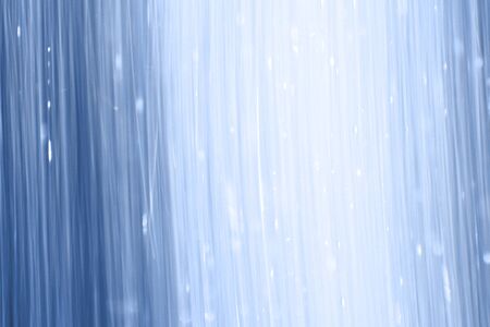 pretty blue shining falling glitters long exposure texture - abstract photo backgroundの写真素材