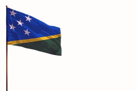 Fluttering Solomon Islands flag isolated, mockup with the place for your text on white background.の写真素材