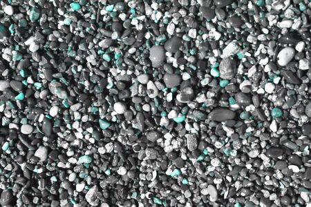 beautiful light blue glossy lake boulders wet by waves texture - abstract photo background