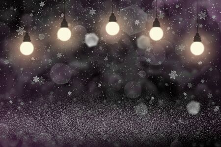 glow fantastic shiny abstract background glitter lights with light bulbs and falling snow flakes fly defocused bokeh - holiday mockup texture with blank space for your contentの写真素材