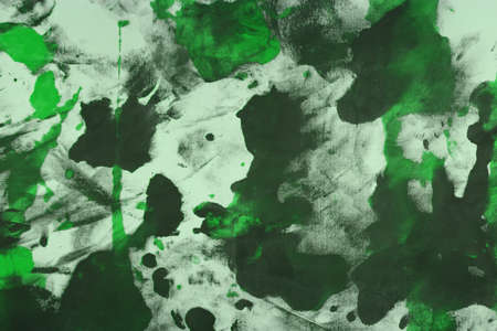 pretty shabby green randomly painted canvas, fabric with color paint spots and blots texture for use as background.の写真素材