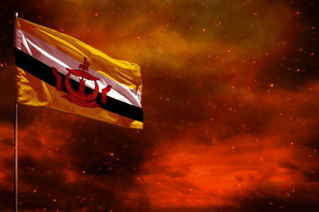 Fluttering Brunei Darussalam flag mockup with blank space for your data on crimson red sky with...