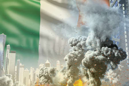 big smoke pillar with fire in the modern city - concept of industrial disaster or terroristic act on Ireland flag background, industrial 3D illustrationの写真素材