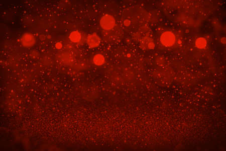 red cute brilliant abstract background glitter lights with sparks fly defocused bokeh - festive mockup texture with blank space for your contentの写真素材