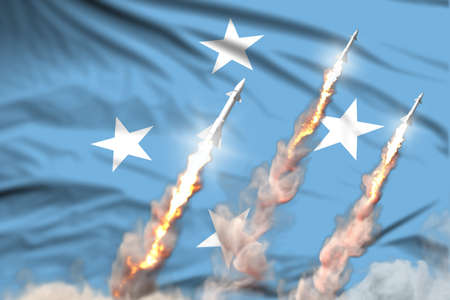 Micronesia nuclear warhead launch - modern strategic nuclear rocket weapons concept on flag fabric background, military industrial 3D illustration with flagの写真素材