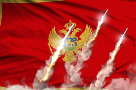 Modern strategic rocket forces concept on flag fabric background, Montenegro supersonic warhead...