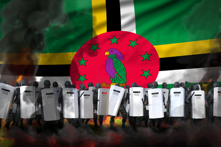 Dominica police officers in heavy smoke and fire protecting state against disorder - protest fighting concept, military 3D Illustration on flag backgroundの写真素材