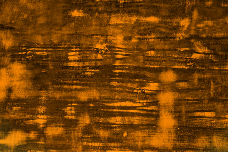 pretty orange old texture of wooden block with a lot of scratched spots - abstract photo background