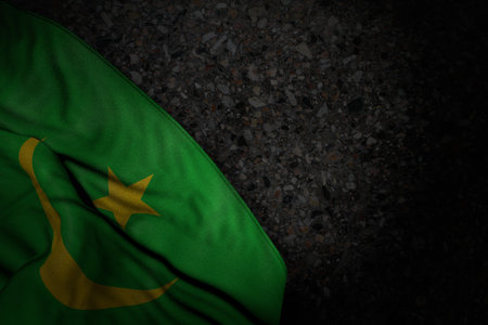 pretty celebration flag 3d illustration - dark illustration of Mauritania flag with large folds on dark asphalt with empty place for your textの写真素材