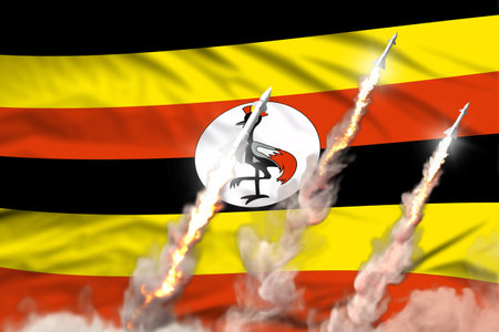 Modern strategic rocket forces concept on flag fabric background, Uganda ballistic missile attack - military industrial 3D illustration, nuke with flagの写真素材