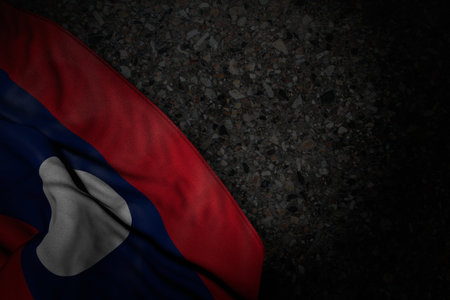 cute feast flag 3d illustration - dark picture of Lao People Democratic Republic flag with large folds on dark asphalt with free space for your textの写真素材