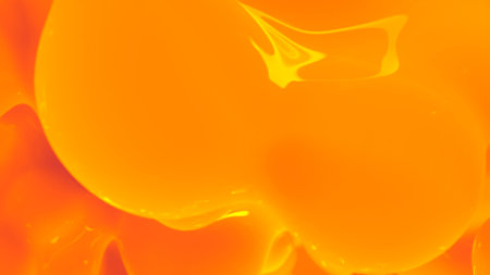 orange honey color reflecting fantastic wax shapes backdrop - abstract 3D illustrationの写真素材