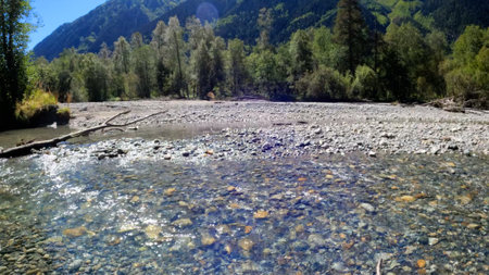 tiny clear cold stream with boulder stones in Arkhyz mountains - photo of natureの写真素材