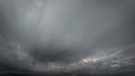 pretty cloudscape of sky with heavy rain or snow clouds backdrop - photo of natureの写真素材