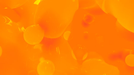 orange honey color reflecting smooth wax drops background - abstract 3D renderingの写真素材