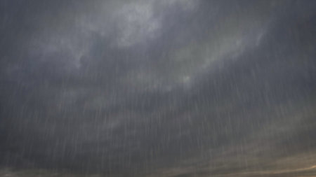 falling rain on sky with clouds - beautiful weather backdrop - photo of natureの写真素材