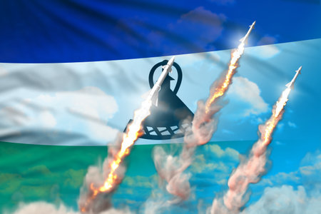 Lesotho supersonic missile launch - modern strategic nuclear rocket weapons concept on blue sky background, military industrial 3D illustration with flagの写真素材