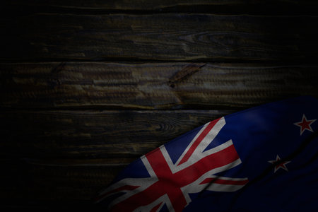 wonderful holiday flag 3d illustration - dark image of New Zealand flag with large folds on old wood with empty space for your contentの写真素材