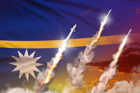 Nauru nuclear missile launch - modern strategic nuclear missile weapons concept on sunset background, military industrial 3D illustration with flagの写真素材