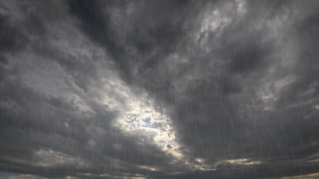 cloudburst on sky with clouds - pretty weather background - photo of natureの写真素材