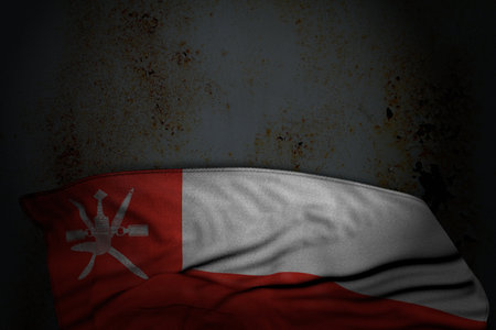 nice dark illustration of Oman flag with large folds on rusty metal with free space for content - any occasion flag 3d illustrationの写真素材