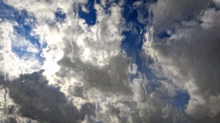 rainfall on sky with clouds - beautiful weather bg - photo of natureの写真素材