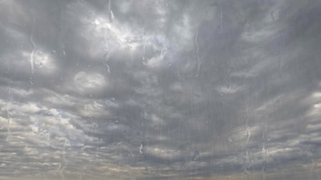 heavy rain on sky with clouds - nice weather background - photo of natureの写真素材