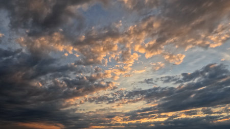 pretty sundown golden clouds on the sky background - photo of natureの写真素材