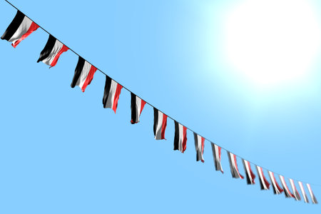 cute many Yemen flags or banners hangs diagonal on rope on blue sky background with bokeh - any occasion flag 3d illustrationの写真素材