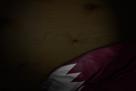 nice dark photo of Qatar flag with big folds on dark wood with empty place for your text - any celebration flag 3d illustrationの写真素材