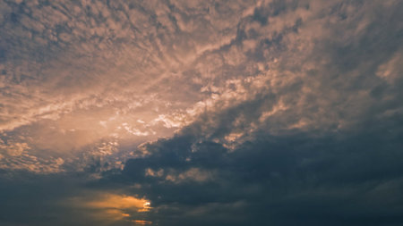 nice sunset golden clouds on the sky backdrop - photo of natureの写真素材
