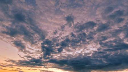 pretty sundown goldish clouds on the sky background - photo of natureの写真素材