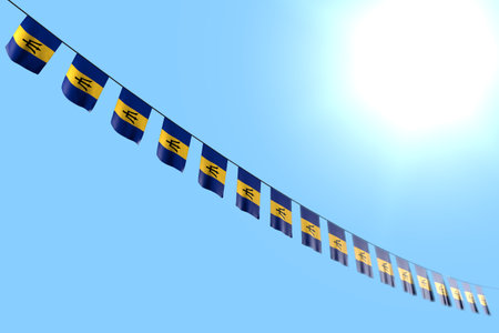 beautiful many Barbados flags or banners hanging diagonal on string on blue sky background with soft focus - any occasion flag 3d illustrationの写真素材