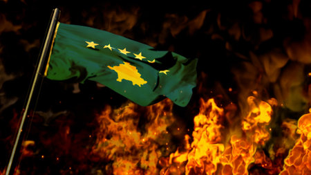 flag of Kosovo on burning fire backdrop - hard times concept - abstract 3D illustrationの写真素材