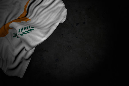 pretty national holiday flag 3d illustration - dark illustration of Cyprus flag with big folds on black stone with free place for contentの写真素材